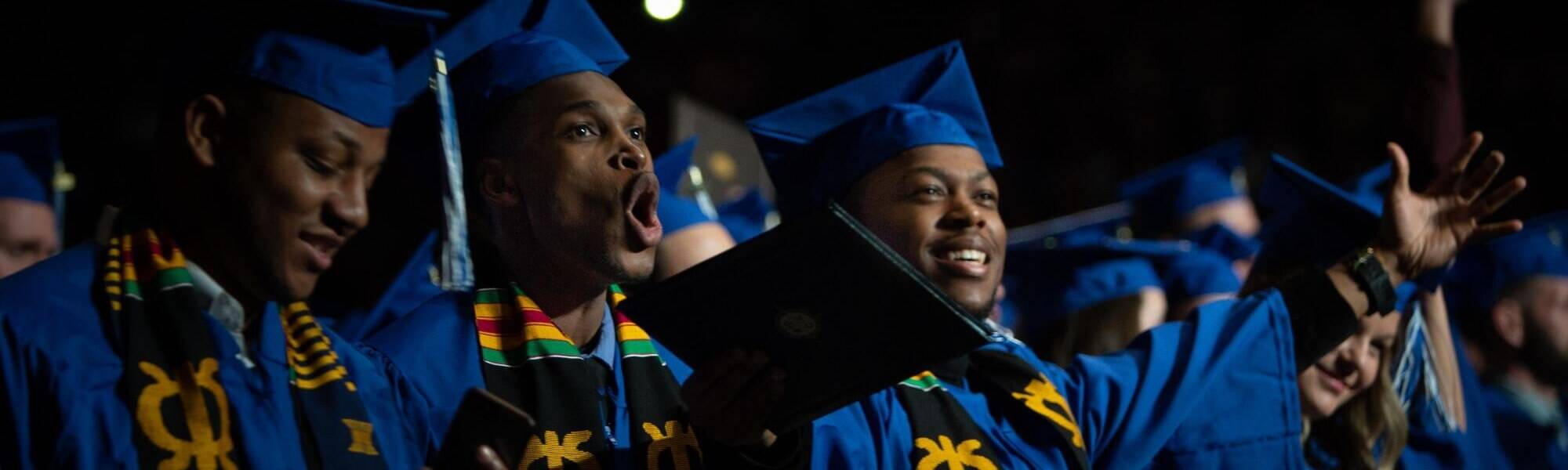 Students cheering at commencement